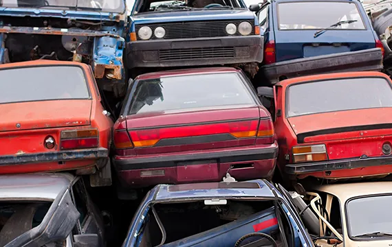 A chaotic pile of junk cars, representing the need for Fast Cash for Junk Cars in Alpharetta, GA.