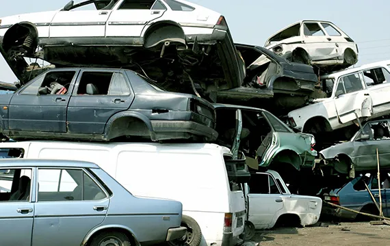 A pile of junk cars stacked together, representing our Junk Car Removal Services in Buckhead, GA.