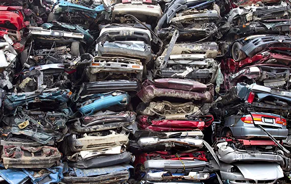 A stack of junk cars piled on top of each other for the Top Cash for Junk Cars service in Dacula GA.