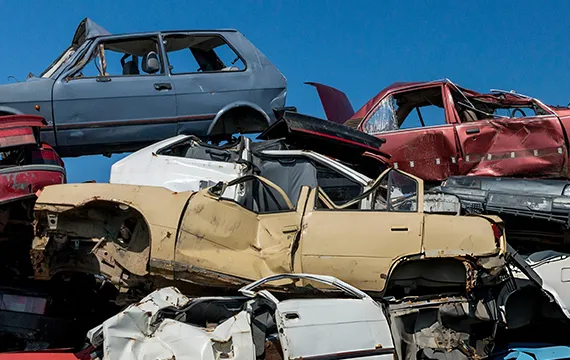 A pile of junk cars stacked together, representing the trusted cash for junk vans service in Grayson, GA.